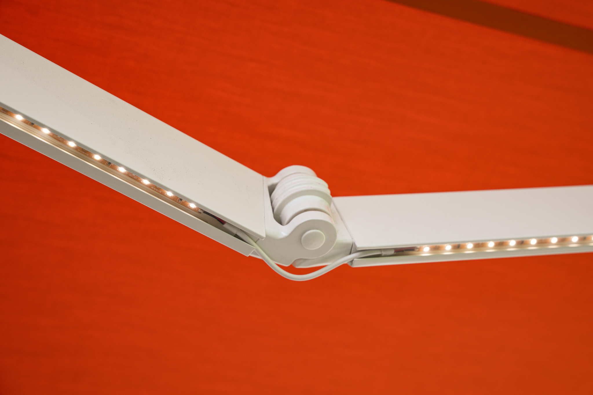 Awning Close Up White Frame LEDLights Hogan Flame