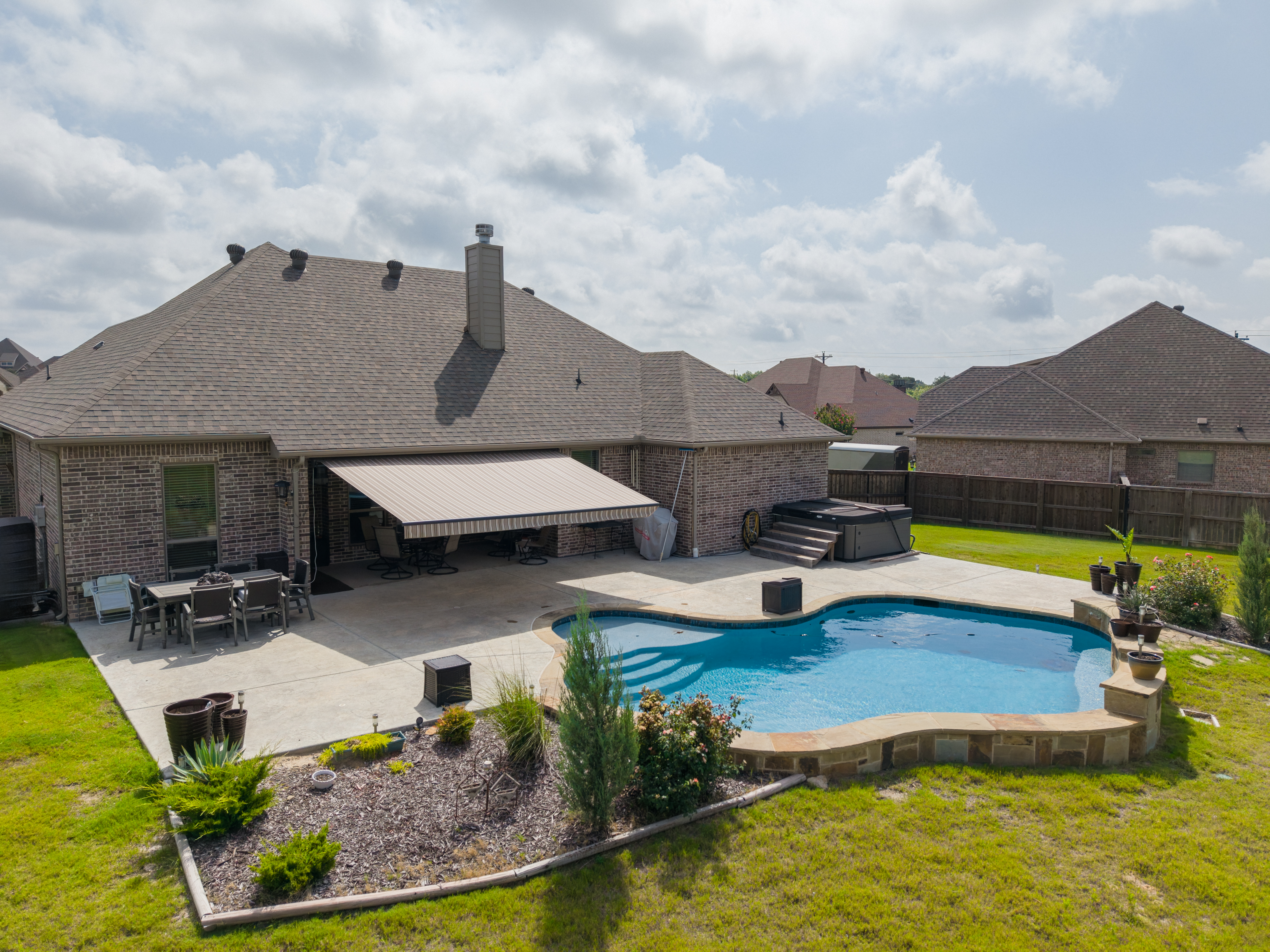 Awning Residential Patio Pool Brick House Extended Aerial View