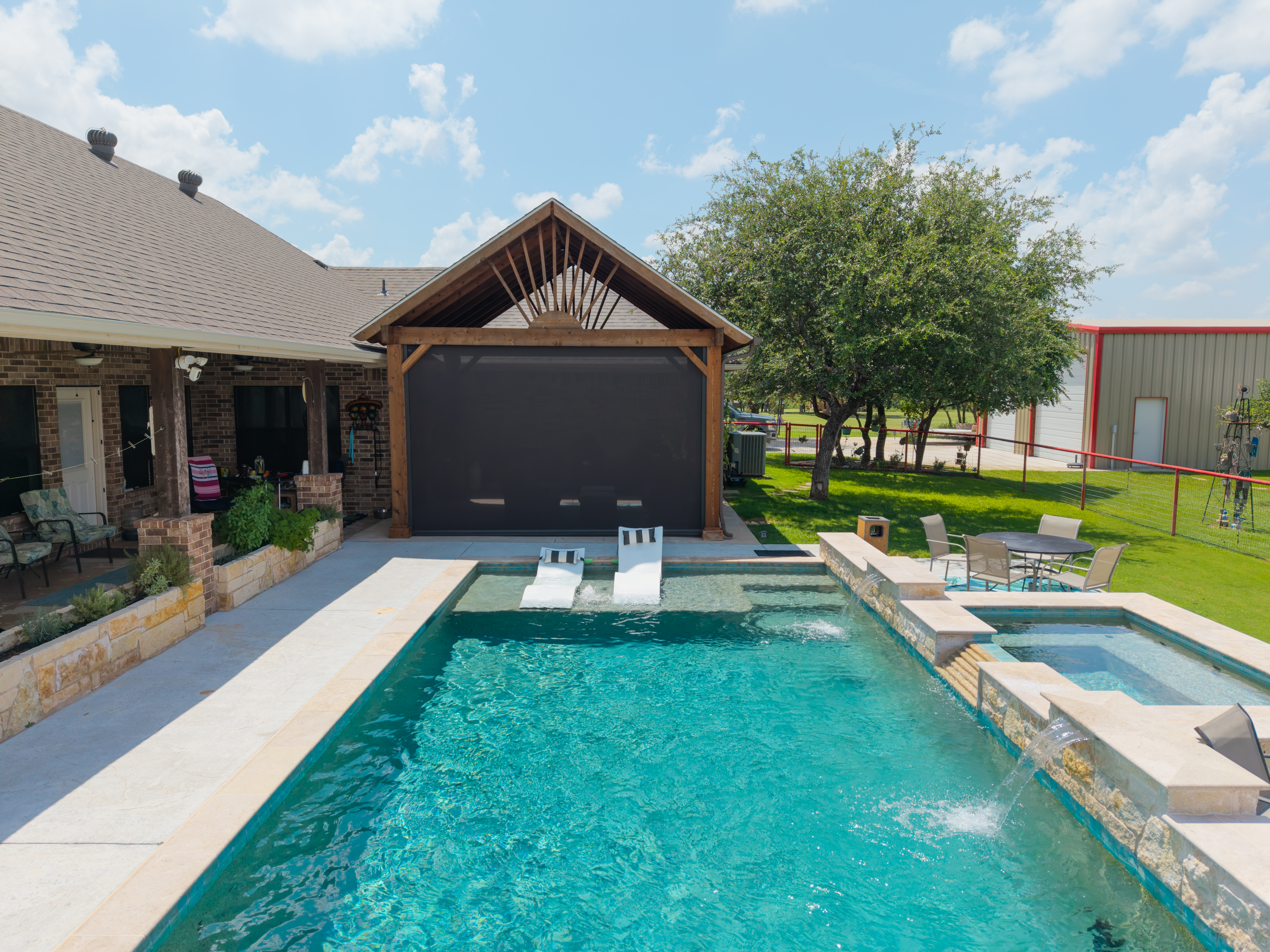 Residential Solar Screen Wood Pergola Patio Pool Exterior Aerial View